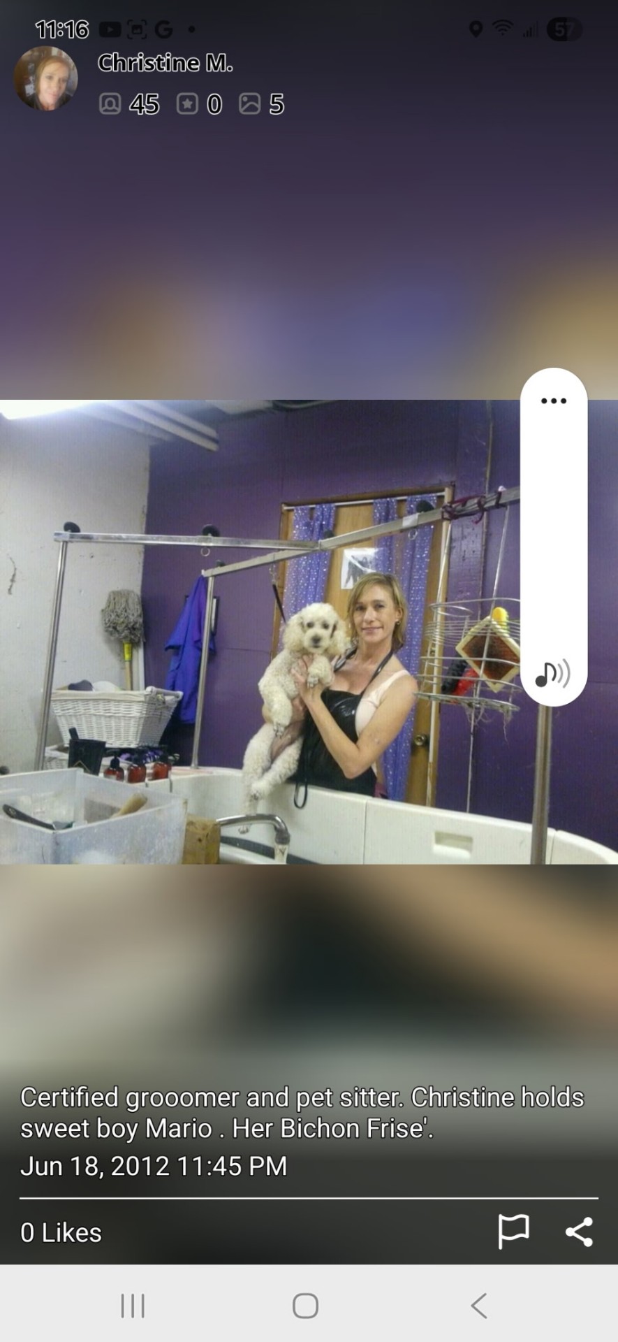 Christine, certified groomer, holding sweet Bichon Frise Mario